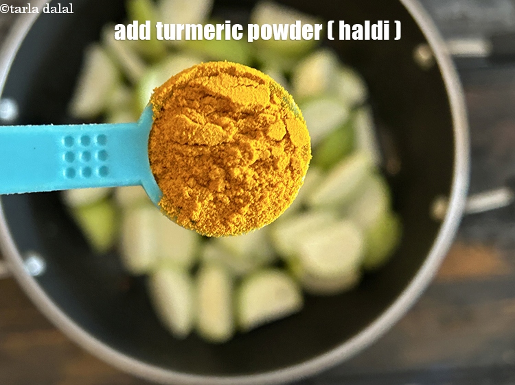 Step 11 – Add&nbsp;<meta charset="UTF-8" />1&nbsp;tsp&nbsp;<a href="glossary-turmeric-powder-haldi-645i">turmeric powder (haldi)</a>.