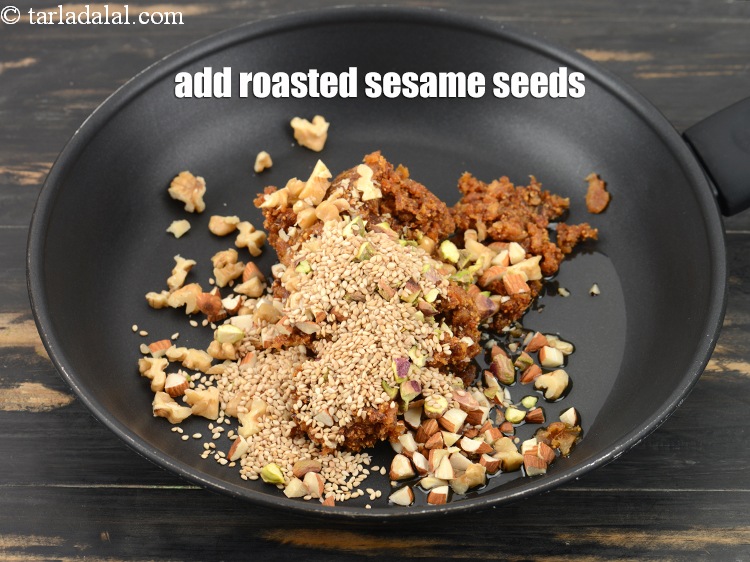 Step 11 – Add 2 tbsp roasted&nbsp;<a href="https://www.tarladalal.com/glossary-sesame-seeds-til-gingelly-seeds-612i">sesame seeds (til)</a>.