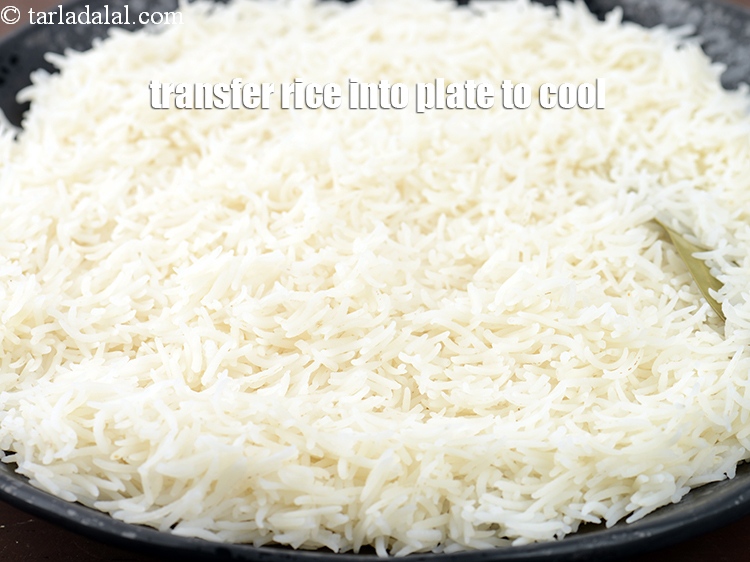 Step 15 – Transfer the rice into a big plate to cool.