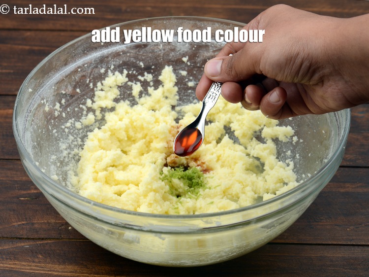Step 12 – Add 2&nbsp;drops&nbsp;<a href="https://www.tarladalal.com/glossary-broken-cashew-nut-2795i">yellow gel food colour</a>.