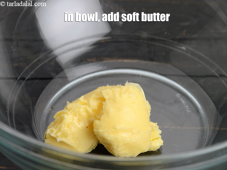 Step 11 – In a big bowl, add &frac14; cup <a href="https://www.tarladalal.com/glossary-soft-butter-naram-makhan-1942i">soft butter</a>.