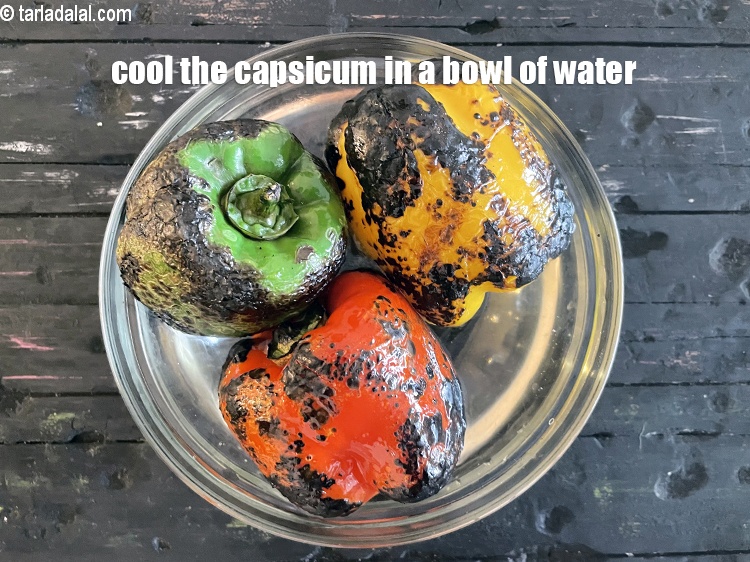 Step 11 – <meta charset="UTF-8" />Cool the capsicum and put in a bowl of water.&nbsp;&nbsp;