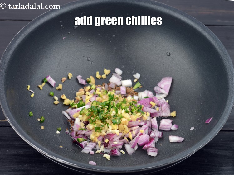 Step 11 – Add 1 tsp finely chopped&nbsp;<a href="https://www.tarladalal.com/glossary-chopped-green-chilli-820i">green chillies</a>