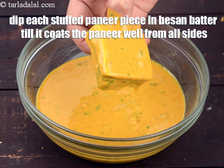 Step 22 – Dip each stuffed paneer piece in besan batter till it coats the paneer well from …