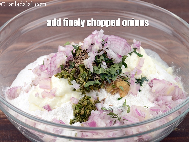 Step 11 – Add &frac14; cup finely <a href="https://www.tarladalal.com/glossary-chopped-onions-722i">chopped onions</a>.
