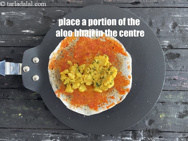 Step 73 – Place a portion of the prepared potato bhaji in the center.