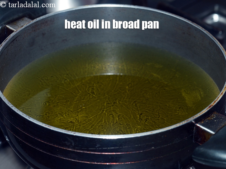 Step 11 – Heat oil in a broad non stick pan.