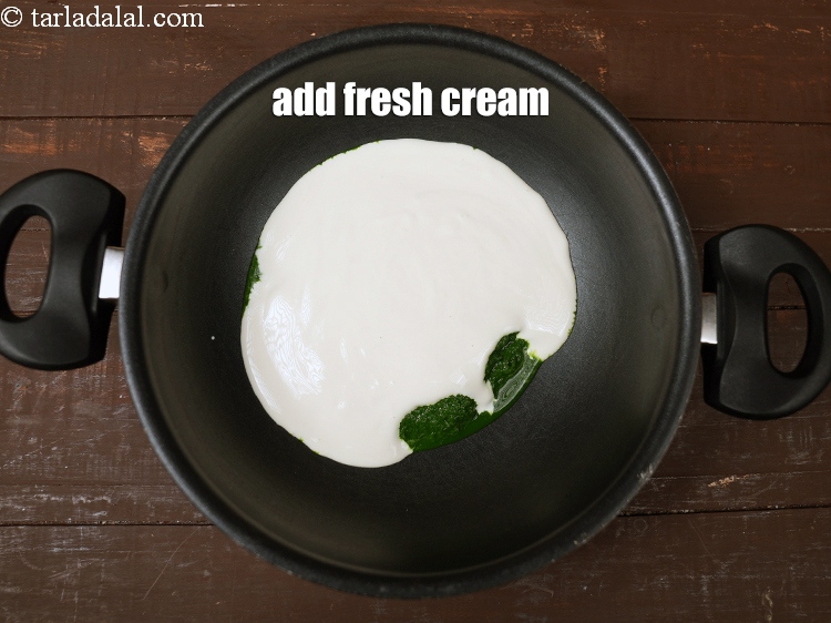 Step 12 – Add 1 cup <a href="https://www.tarladalal.com/glossary-fresh-cream-1877i">fresh cream</a>.