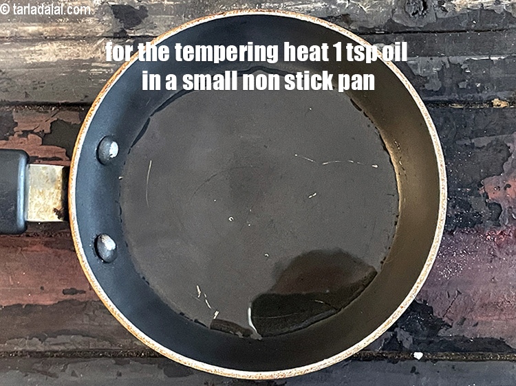 Step 20 – For the tempering, heat 1 tsp oil in a small non-stick pan.