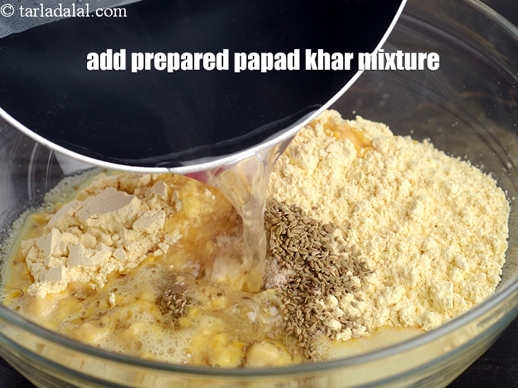 Step 12 – Add the prepared papad khar mixture.