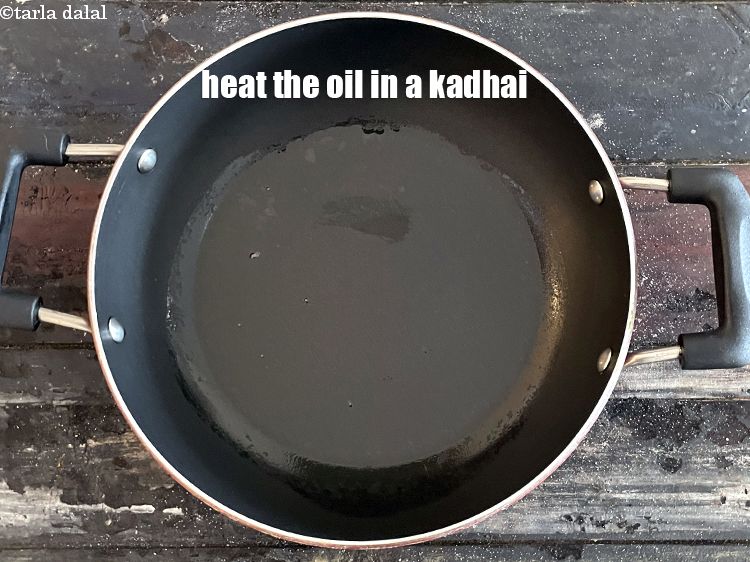 Step 27 – Heat <meta charset="UTF-8" />2 tsp&nbsp;<a href="glossary-soy-oil-1437i">soya oil</a>&nbsp;or&nbsp;coocnut oil or oil&nbsp;in a kadhai.