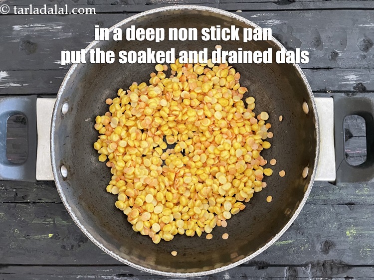 Step 12 – In a <meta charset="UTF-8" />deep non-stick pan, put the soaked and drained dals.