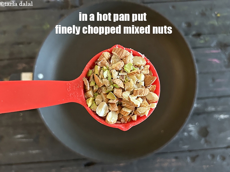 Step 11 – In a hot pan put&nbsp;<!--%3Cmeta%20charset%3D%22UTF-8%22%20%2F%3E-->1/4 cup&nbsp;finely&nbsp;<a href="glossary-chopped-mixed-nuts-928i">chopped mixed nuts</a>&nbsp;(pistachios , almond and walnuts)