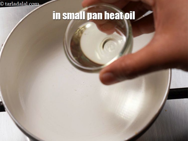 Step 12 – For the tempering, in a small non-stick pan heat 2 tsp <a href="https://www.tarladalal.com/glossary-oil-671i">oil</a>.