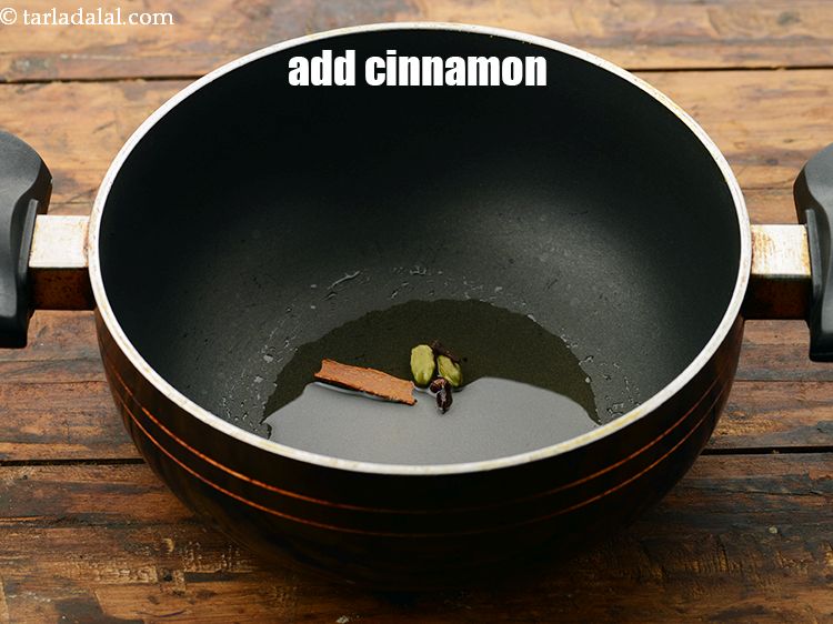 Step 20 – Add <a href="https://www.tarladalal.com/glossary-cinnamon-dalchini-346i" target="_blank">cinnamon</a>.