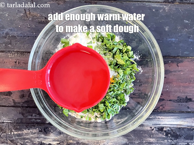 Step 11 – Add enough warm water to make a soft dough. We added 1/2&nbsp;cup of warm water.