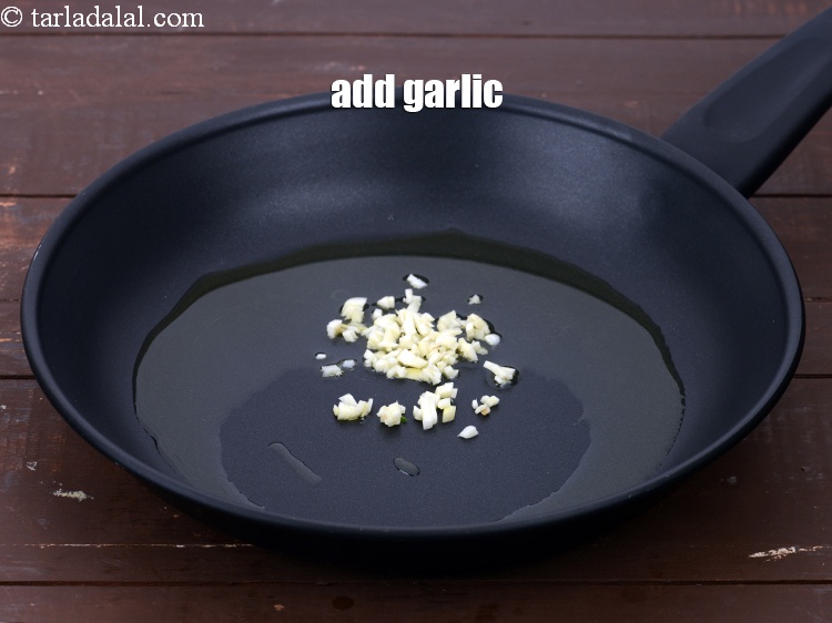 Step 11 – Add 2 tsp&nbsp;finely&nbsp;<a href="https://www.tarladalal.com/glossary-chopped-garlic-790i">chopped garlic (lehsun)</a>.&nbsp;