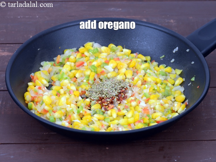Step 11 – Add 1/2 tsp&nbsp;<a href="https://tarladalal.com/glossary-dried-oregano-268i">dried oregano</a>. You can also use mixed herbs.&nbsp;