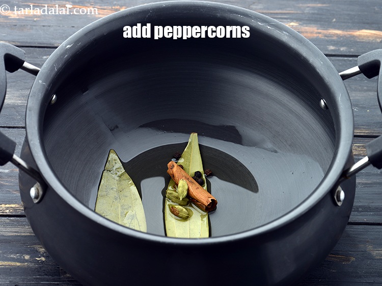 Step 12 – Add 5&nbsp;<a href="https://www.tarladalal.com/glossary-peppercorns-584i">peppercorns (kalimirch)</a>.&nbsp;