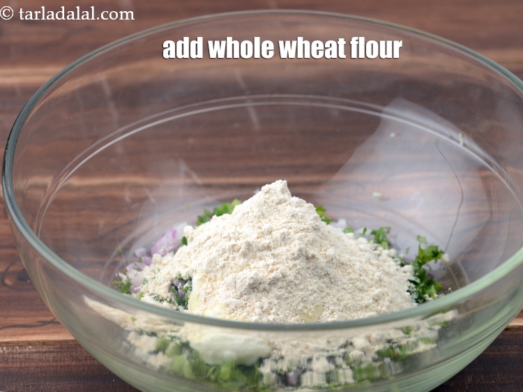 Step 11 – Add 1/4 cup <a href="https://www.tarladalal.com/glossary-whole-wheat-flour-gehun-ka-atta-gehun-ka-aata-429i">whole wheat flour (gehun ka atta)</a>.