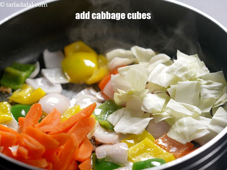 Step 19 – Add 1/2 cup&nbsp;<a href="https://www.tarladalal.com/glossary-cabbage-cubes-736i">cabbage cubes</a>.&nbsp;