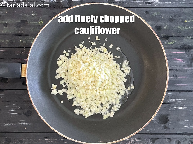 Step 12 – Add&nbsp;<meta charset="UTF-8" />1 1/2 cups finely&nbsp;<a href="glossary-chopped-cauliflower-796i">chopped cauliflower</a>.