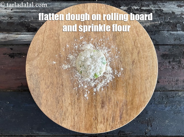 Step 14 – <meta charset="UTF-8" />Take a portion of the dough and flatten it on the rolling board …