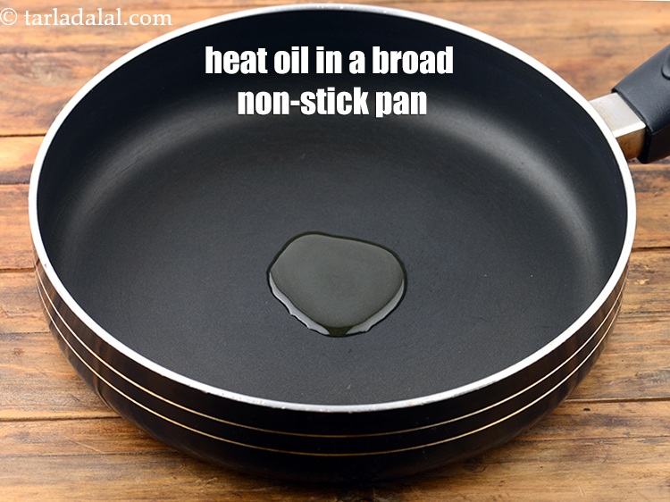 Step 12 – Then heat 2 tbsp&nbsp;<a href="https://www.tarladalal.com/glossary-oil-671i">oil</a>&nbsp;in a broad non-stick pan.&nbsp;