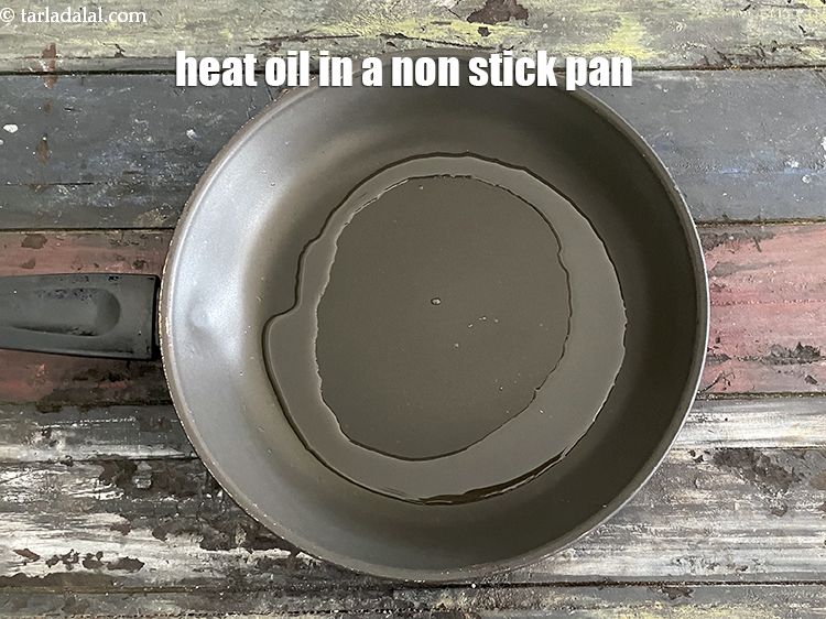 Step 12 – Heat 1 tablespoon&nbsp;oil in a broad non-stick pan.