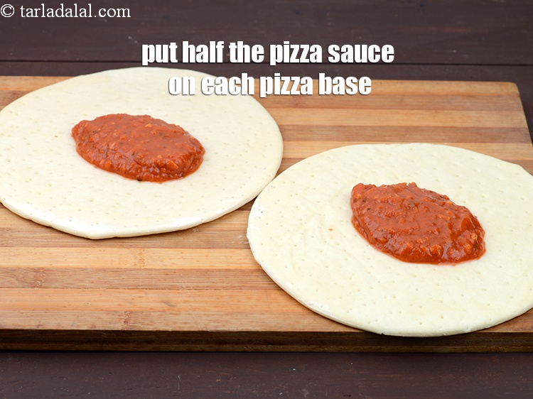 Step 19 – Put 1/2 cup&nbsp;<a href="https://www.tarladalal.com/glossary-pizza-sauce-1889i">pizza sauce</a> on each pizza base.
