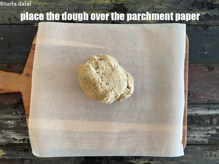 Step 11 – Place the dough over the parchment paper.