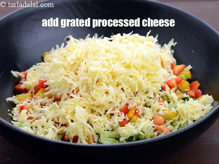 Step 12 – Add 1 cup&nbsp;<a href="https://www.tarladalal.com/glossary-grated-processed-cheese-868i">grated processed cheese</a>.