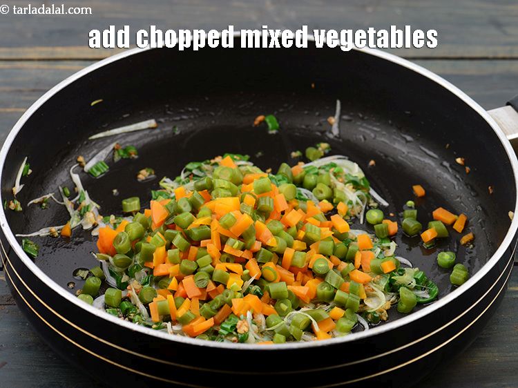 Step 21 – Add 1/2 cup&nbsp;<a href="https://www.tarladalal.com/glossary-chopped-and-parboiled-mixed-vegetables-2424i">chopped and parboiled mixed vegetables</a>