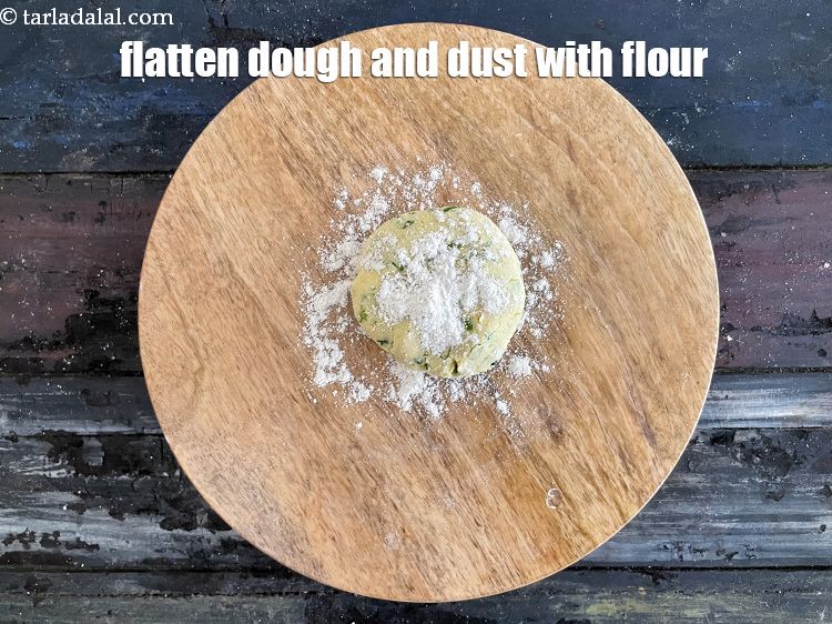 Step 13 – Flatten the dough and dust with whole wheat flour.