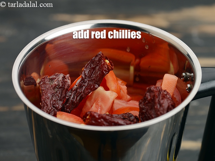 Step 12 – Add 2&nbsp;<a href="https://www.tarladalal.com/glossary-whole-dry-kashmiri-red-chillies-kashmiri-mirch-kashmiri-lal-mirch-332i">whole dry kashmiri red chillies</a>.&nbsp;