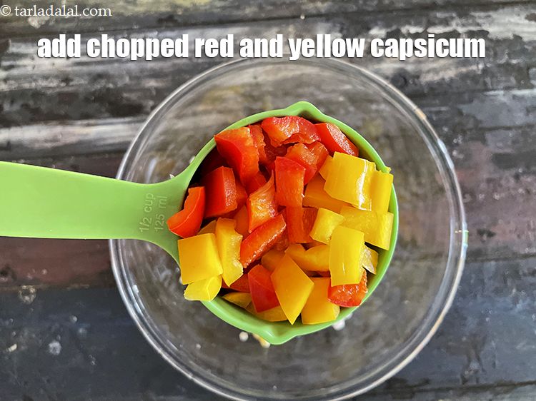 Step 16 – Add&nbsp;<meta charset="UTF-8" />1/2 cup&nbsp;<a href="glossary-chopped-red-capsicum-2299i">chopped red</a>&nbsp;and&nbsp;<a href="glossary-chopped-yellow-capsicum-2300i">yellow capsicum</a>.