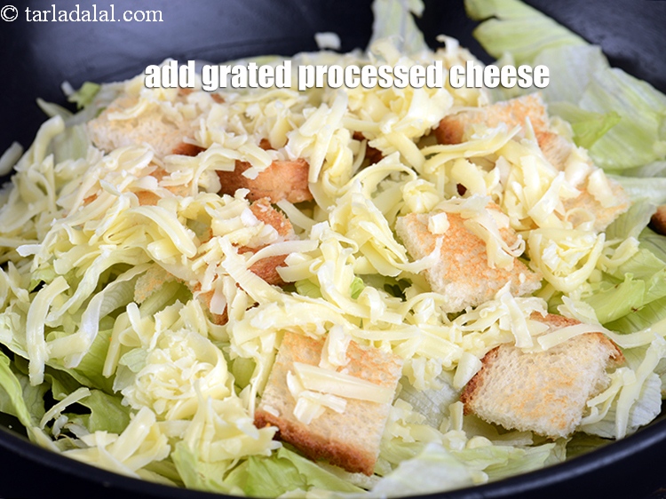 Step 11 – Add 1/2 cup <a href="https://www.tarladalal.com/glossary-grated-processed-cheese-868i">grated processed cheese</a>.