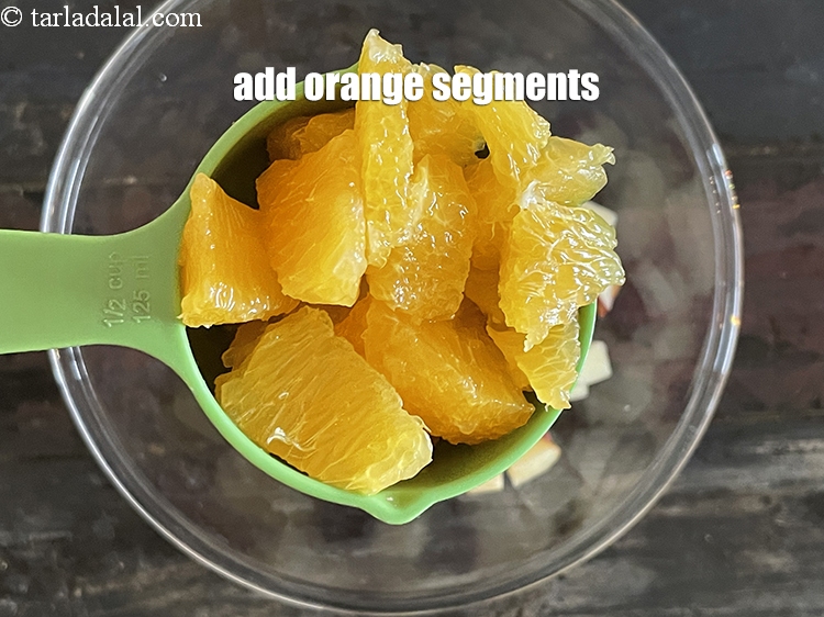 Step 20 – Add&nbsp;<meta charset="UTF-8" />3/4 cup&nbsp;<a href="glossary-orange-segments-116i">orange segments</a>.