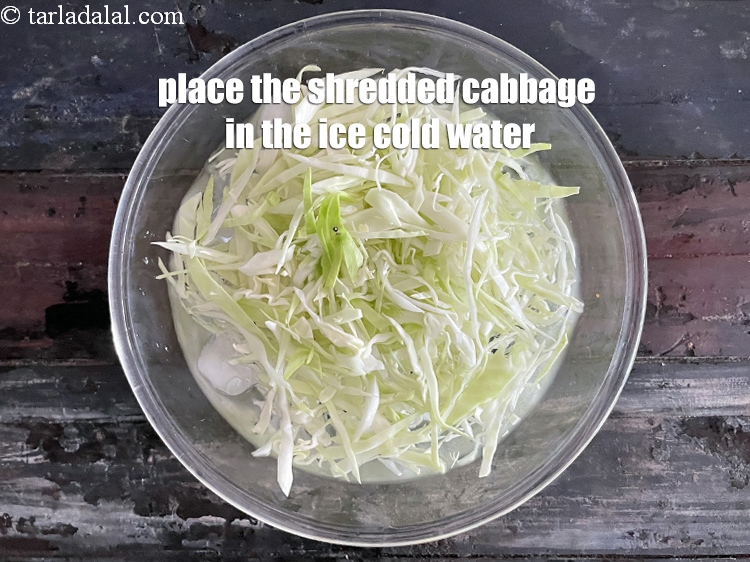 Step 13 – Place the shredded cabbage in&nbsp;ice cold water.