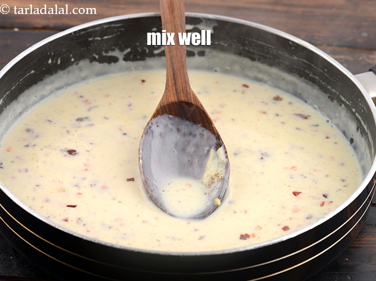 Step 11 – Mix well. Keep aside to cool for 10 minutes to thicken a little.&nbsp;