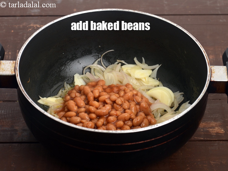 Step 11 – Add the 1/2 cup&nbsp;<a href="https://tarladalal.com/glossary-baked-beans-177i">baked beans</a>.&nbsp;