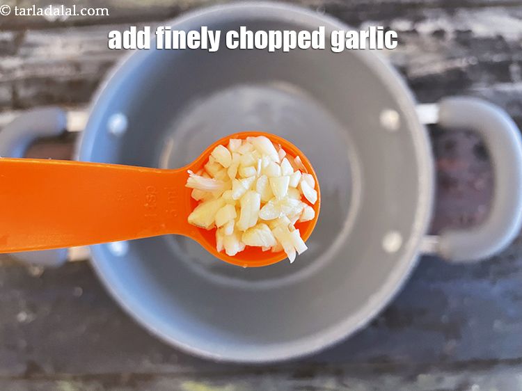 Step 19 – <p>Add&nbsp;1 tsp&nbsp;finely&nbsp;<a href="glossary-chopped-garlic-790i">chopped garlic (lehsun)</a>.</p>