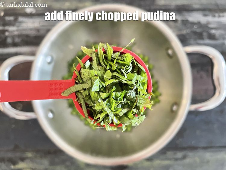 Step 13 – Add&nbsp;1 tbsp&nbsp;finely&nbsp;<a href="https://tarladalal.com/glossary-chopped-mint-788i">chopped mint leaves (phudina)</a>.