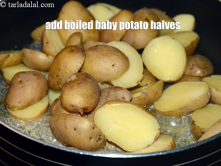 Step 12 – Add 2 1/2 cups <a href="https://www.tarladalal.com/glossary-boiled-baby-potato-halves-2643i">boiled baby potato halves</a>.