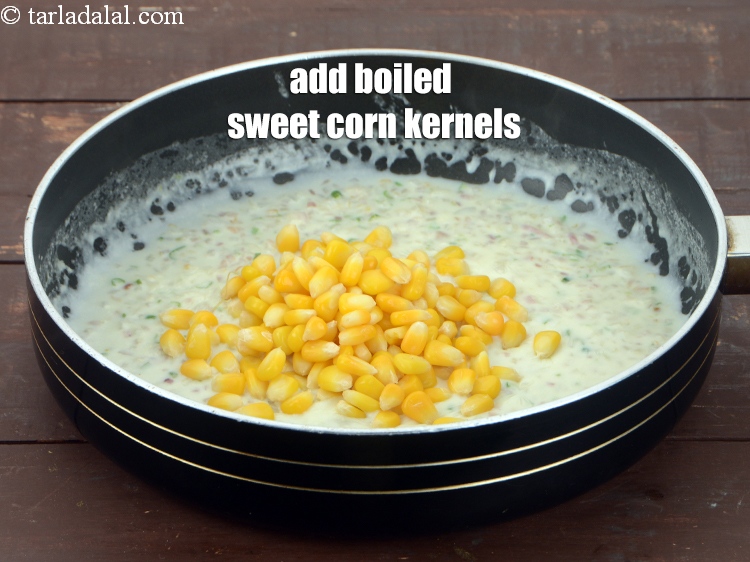 Step 11 – Add &frac12; cup <a href="https://www.tarladalal.com/glossary-boiled-sweet-corn-kernels-153i">boiled sweet corn kernels (makai ke dane)</a>.