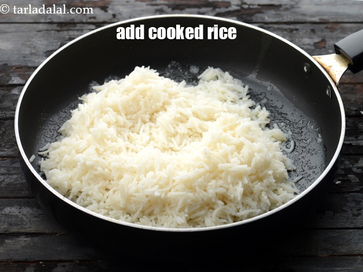 Step 9 – Add 2 1/4 cups&nbsp;<a href="https://www.tarladalal.com/glossary-soaked-and-cooked-long-grain-rice--1904i">cooked rice (chawal)</a>.&nbsp;