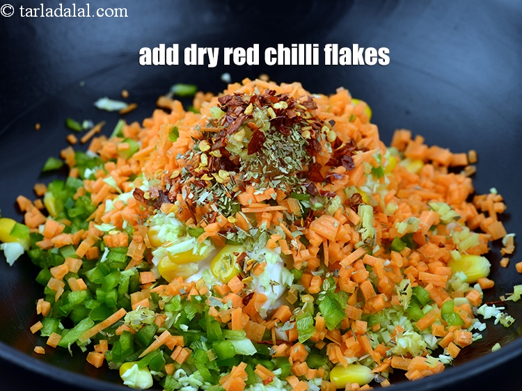 Step 13 – Add 1/2 tsp <a href="https://www.tarladalal.com/glossary-dry-red-chilli-flakes-paprika-338i">dry red chilli flakes (paprika)</a>.