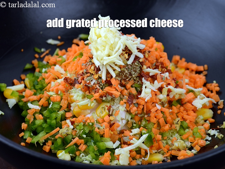 Step 14 – Add 1 tbsp <a href="https://www.tarladalal.com/glossary-grated-processed-cheese-868i">grated processed cheese</a>.