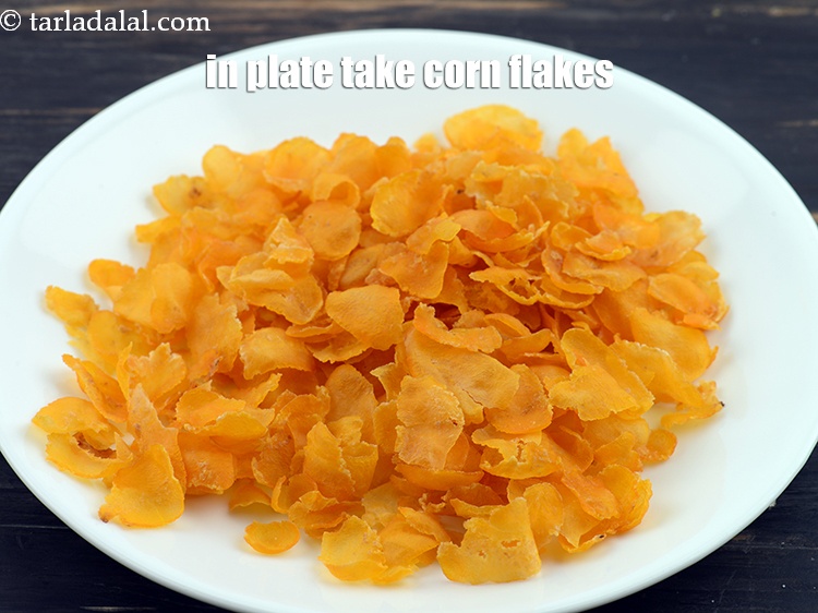 Step 13 – In a plate take <a href="https://www.tarladalal.com/glossary-corn-flakes-157i">corn flakes</a>