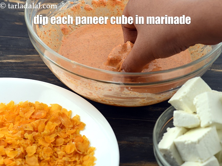 Step 15 – Dip each <a href="https://www.tarladalal.com/glossary-paneer-cubes-cottage-cheese-cubes-1002i">paneer (cottage cheese) cubes</a> in the marinade.